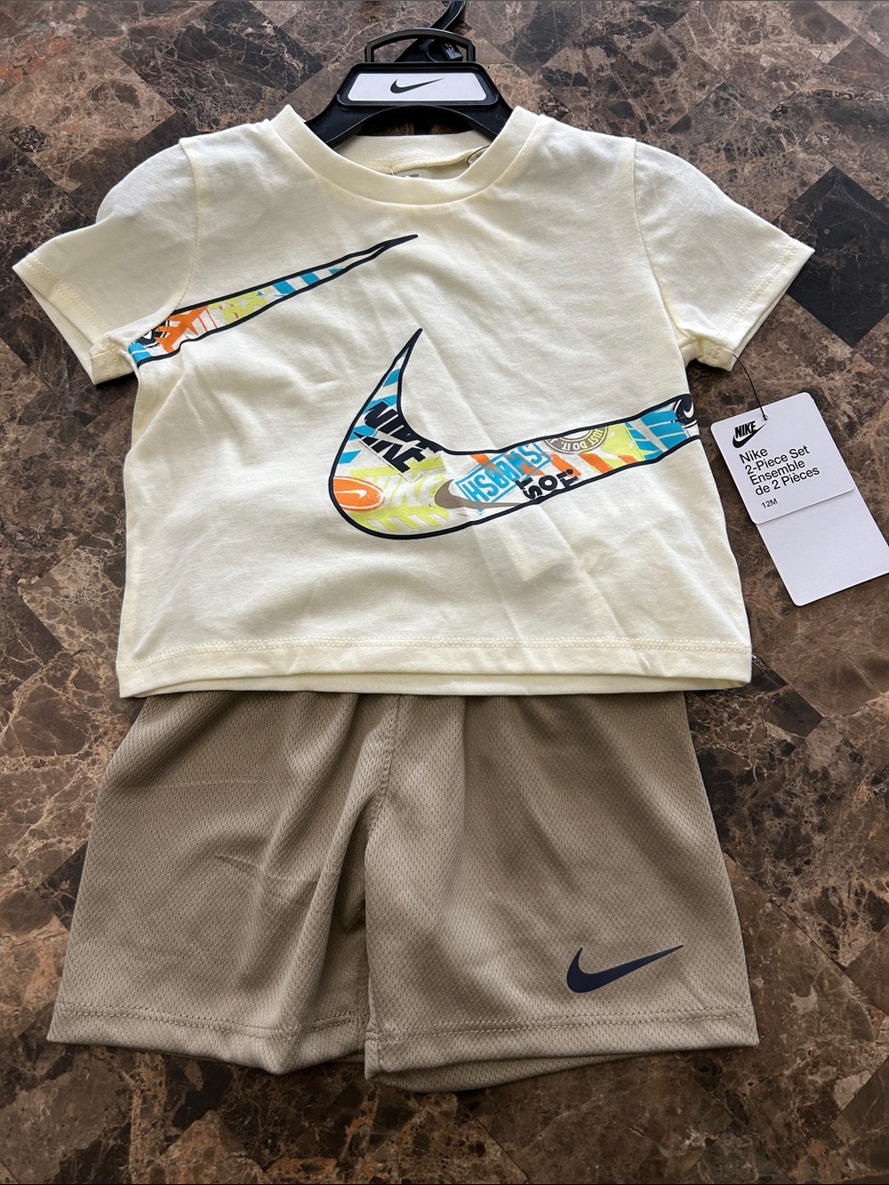 NWT 🆕 Nike Kids Cream Tee & Tan Shorts Set with Multicolor Swoosh size 12 months